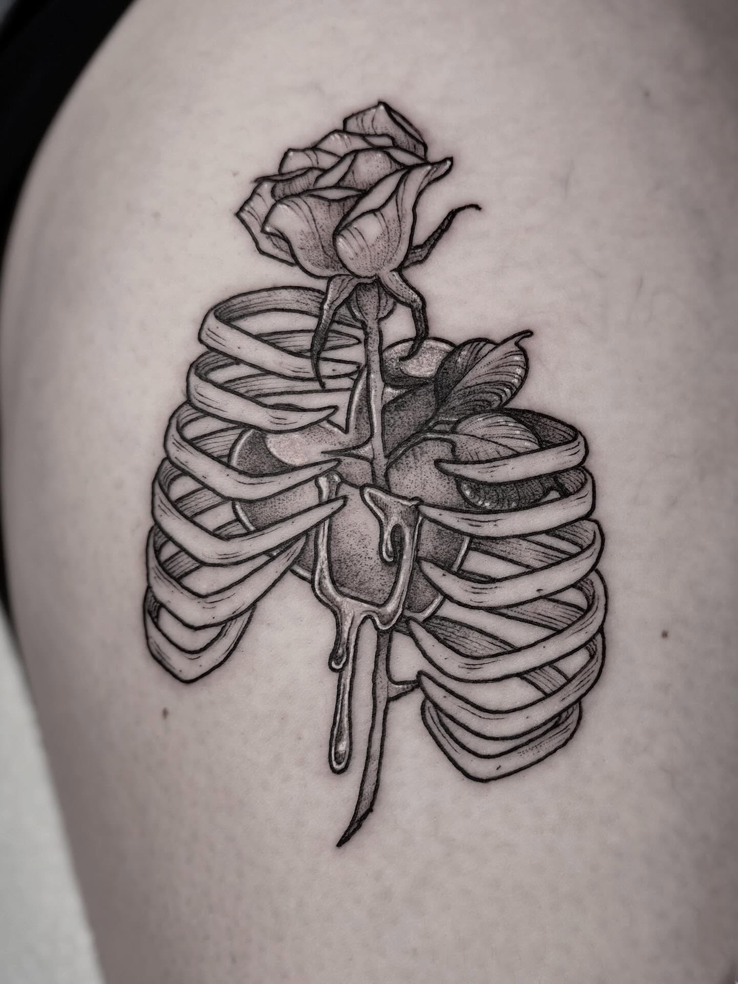 Ribcage with rose realism tattoo on the ribs by Cincinnati