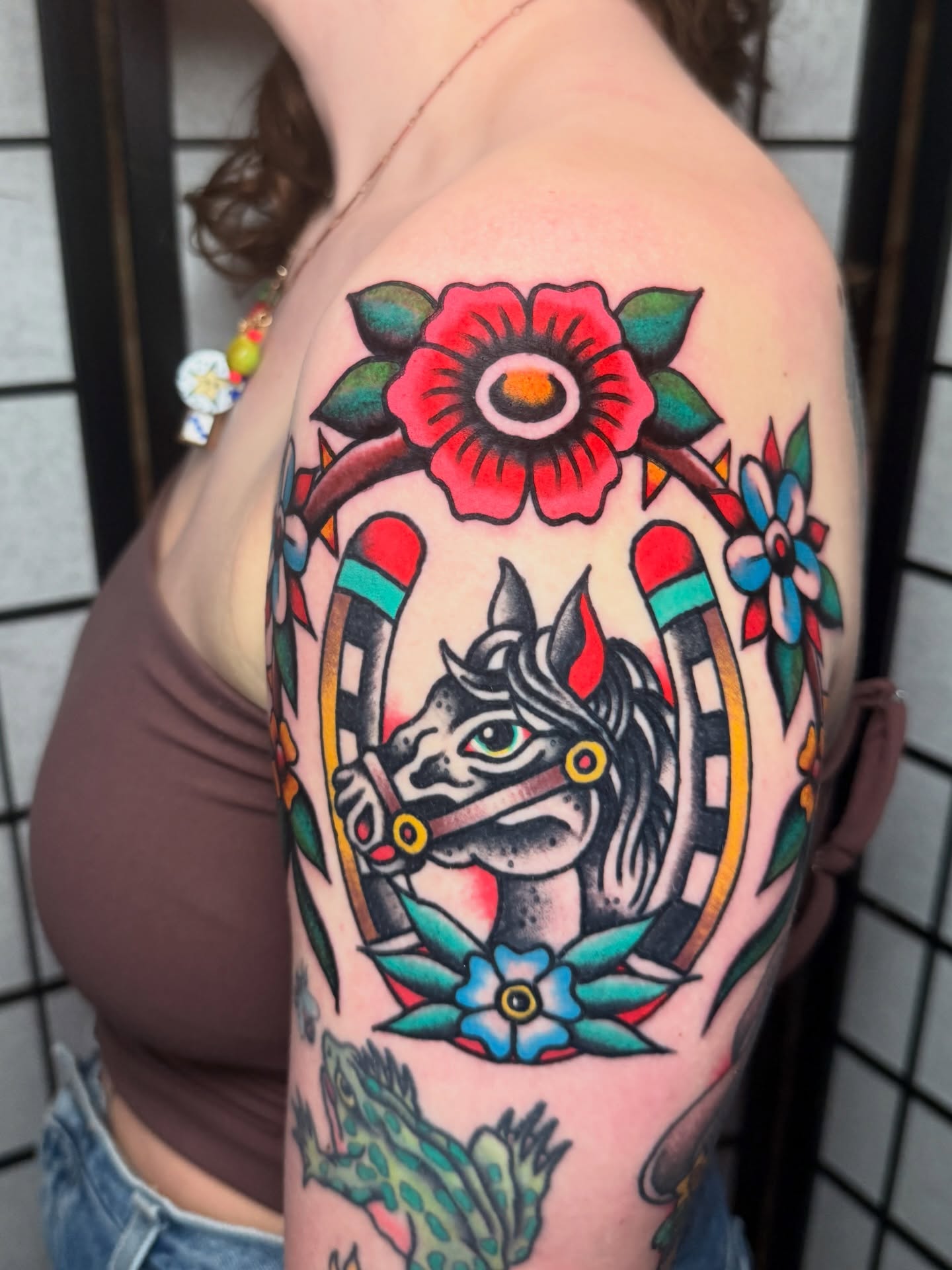 Horse and floral American traditional tattoo on the shoulder by Stevie Lowenstein, Cincinnati, Ohio