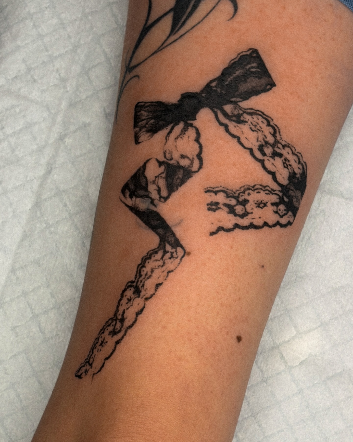 Bow and clouds black and grey tattoo on the forearm by ☆ gia