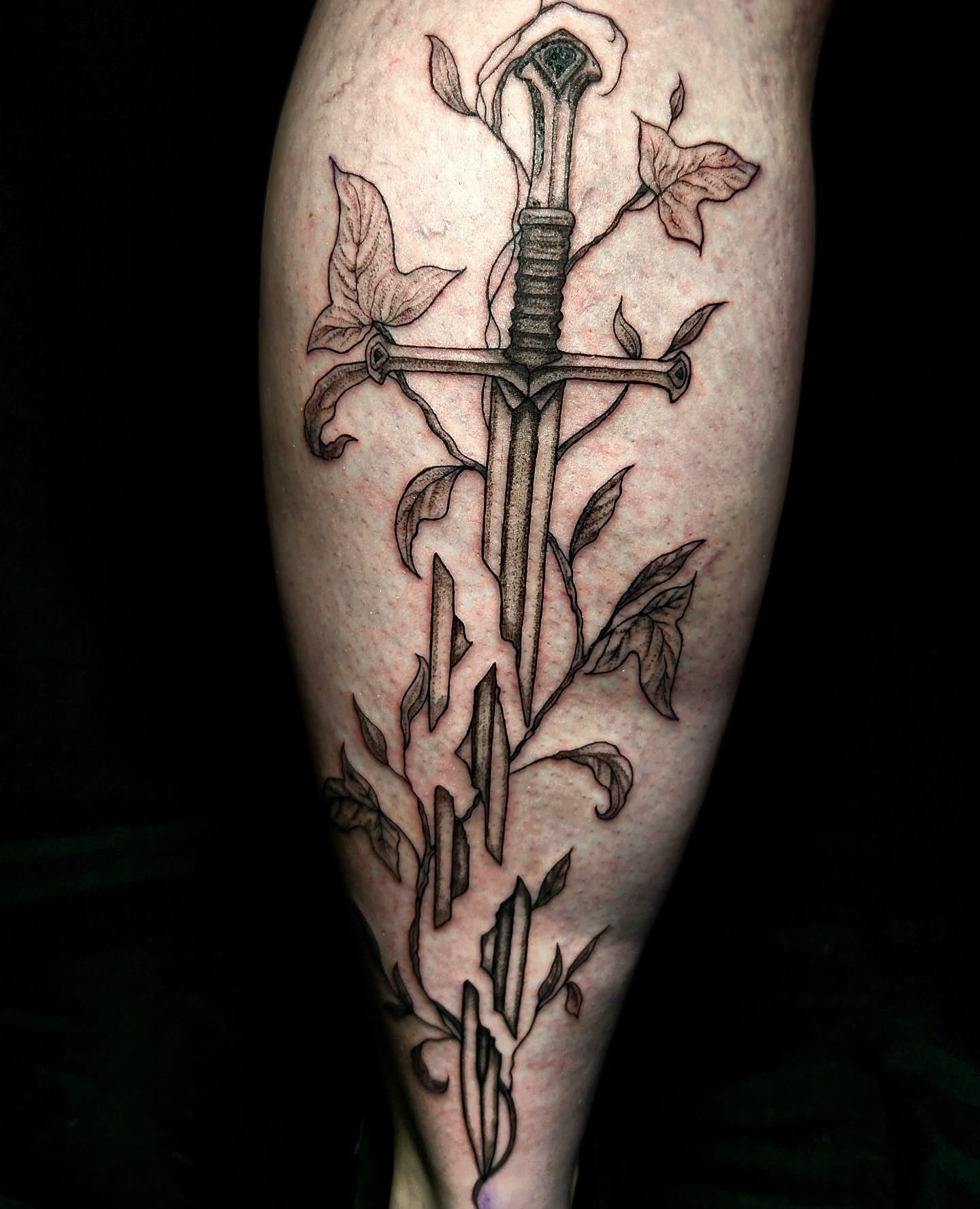 Sword and roses realism tattoo on the forearm by Ashly Renee