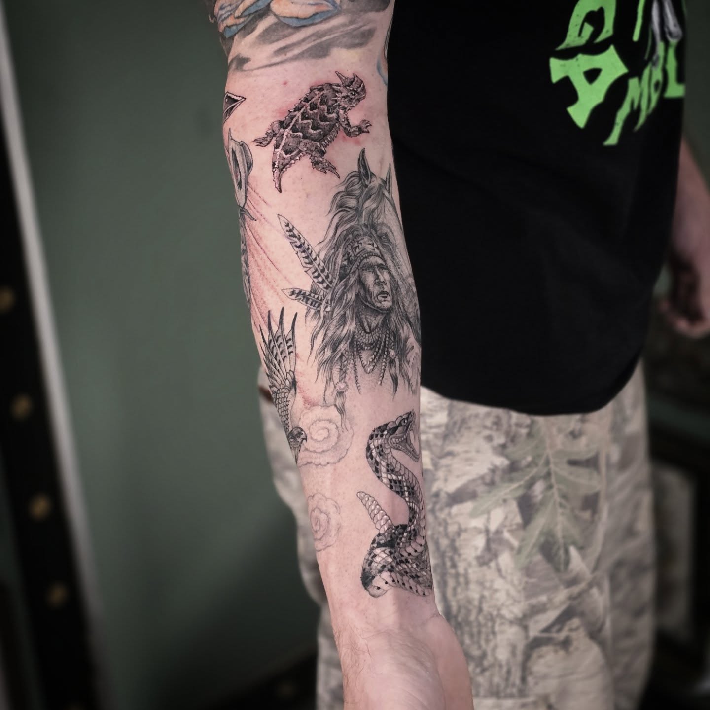 Indian chief and snakes realism tattoo on the forearm by Aaron Dor