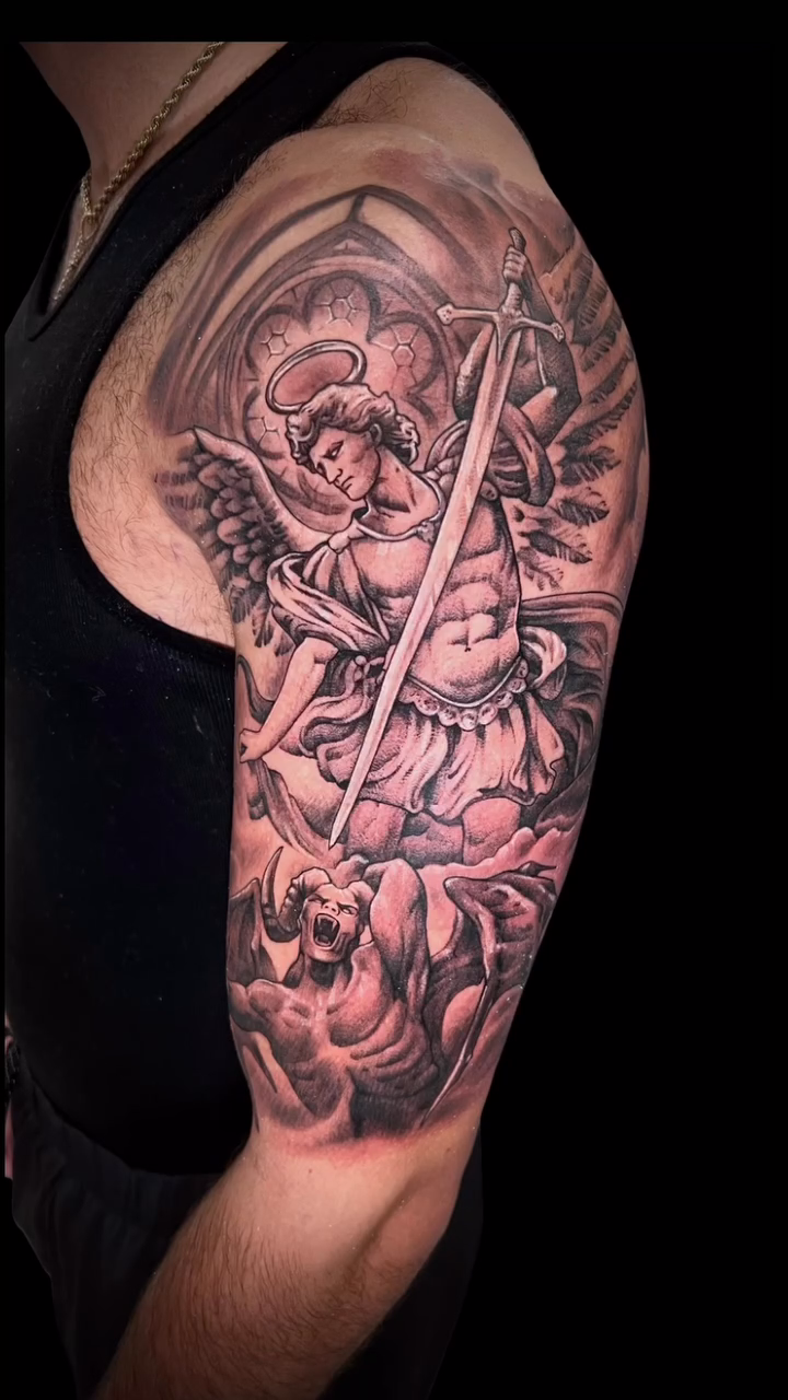 Archangel Michael with sword and shield realism tattoo by Daniel Fisher, Berlin, New Jersey