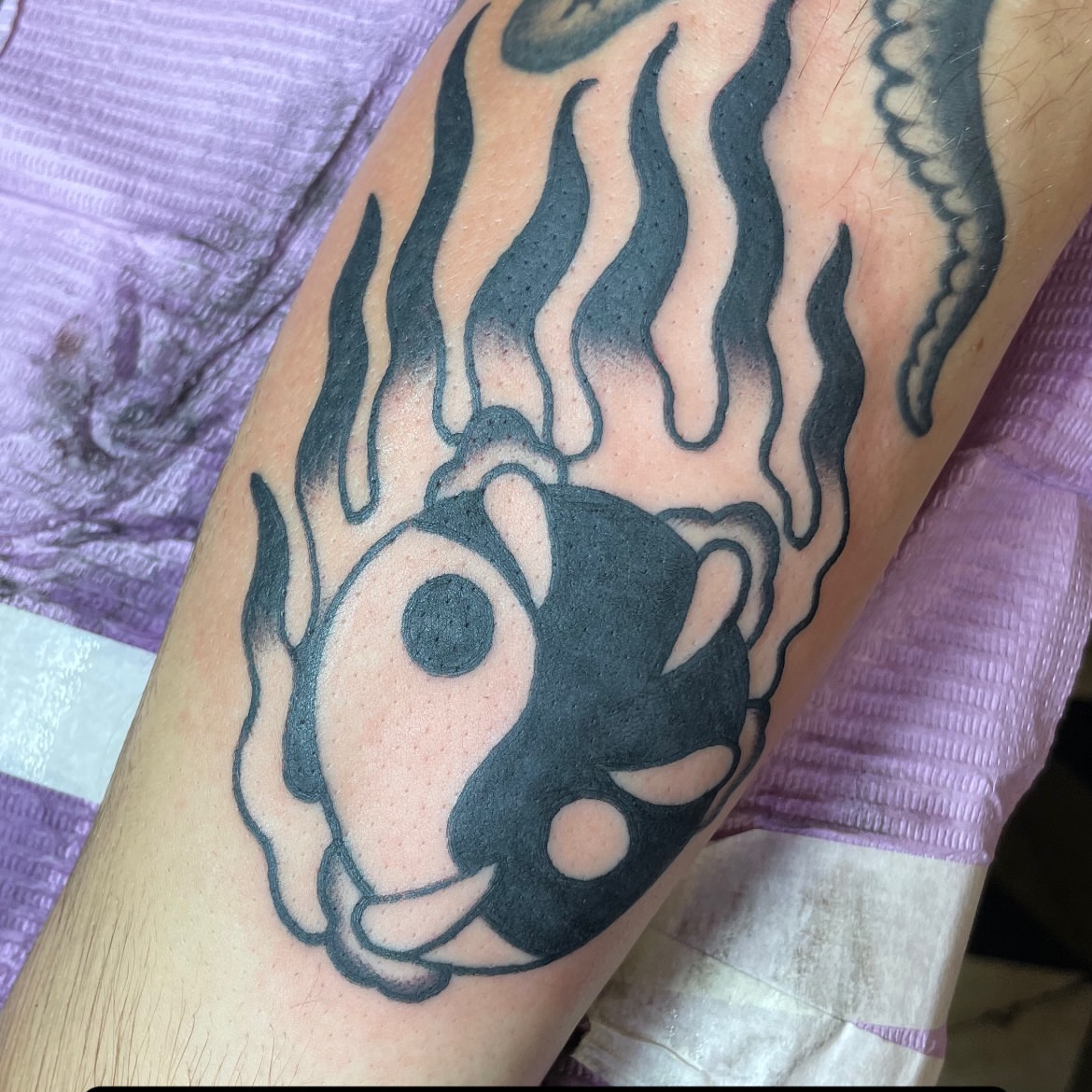 Yin yang symbol black and grey tattoo on the forearm by Greg De Hoot, Youngsville, North Carolina