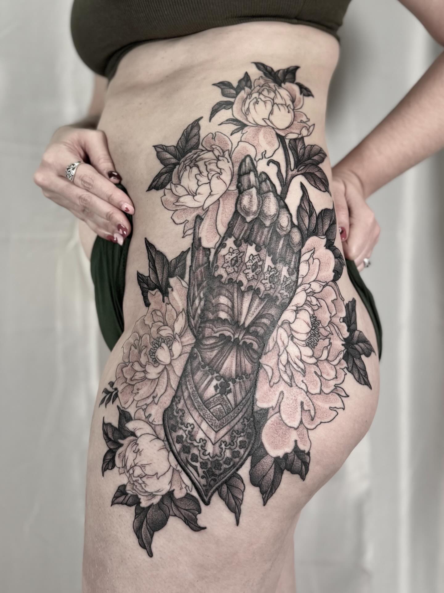 Floral bouquet realism tattoo on the thigh by Hillary