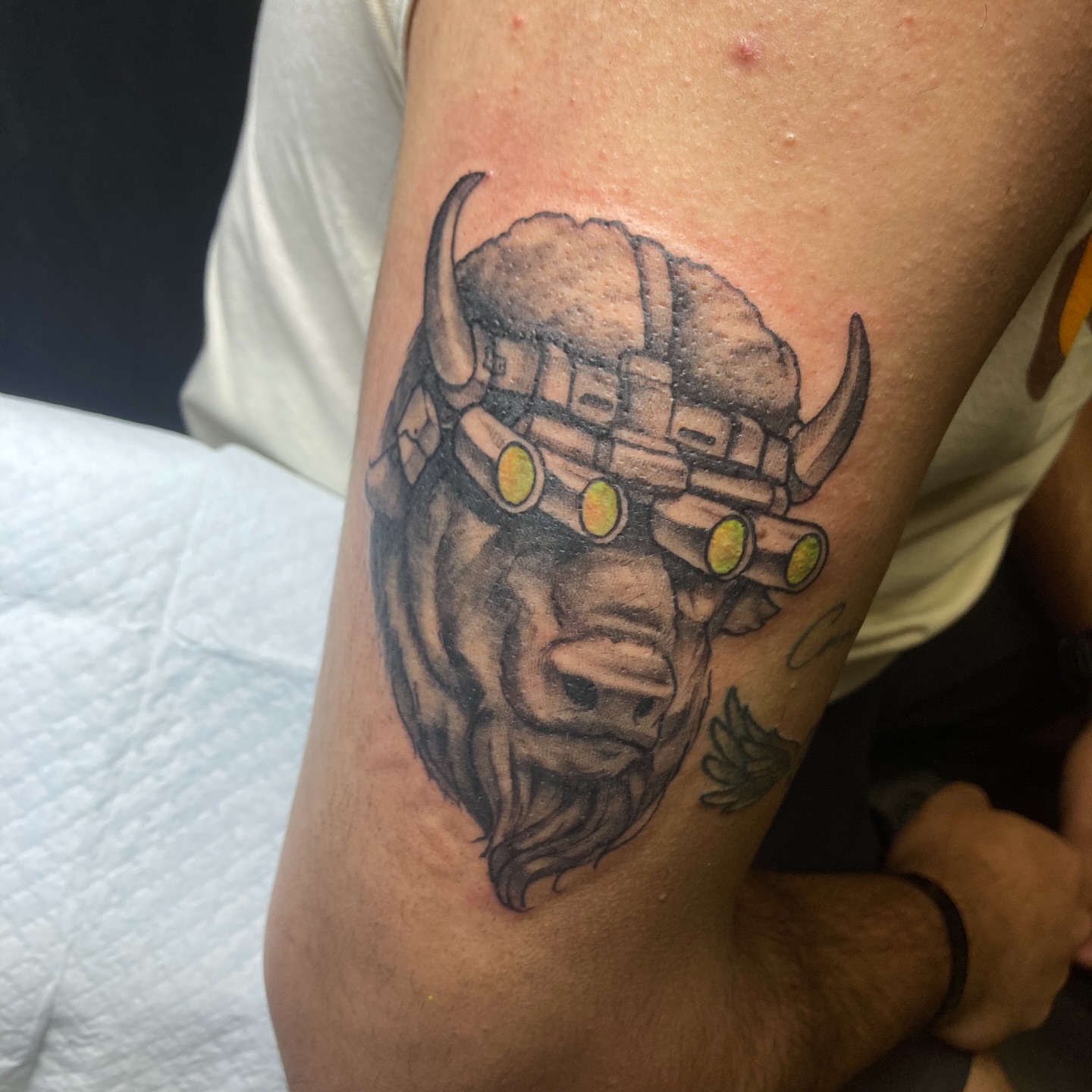 Buffalo helmet black and grey tattoo on the forearm by Eathan Hale-(East TN) Newschool Tattoo Artist