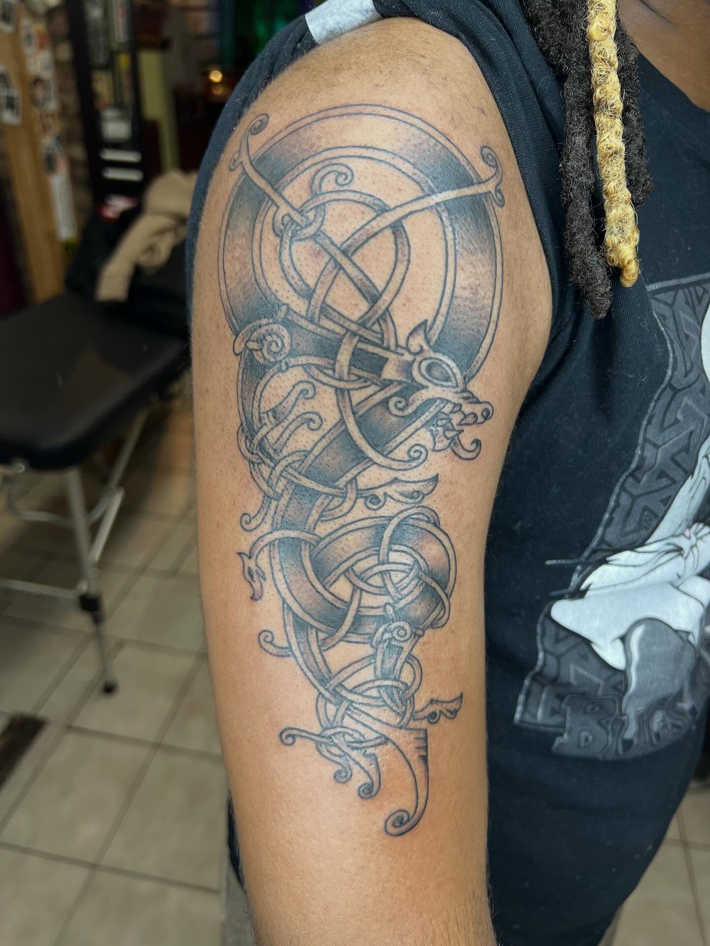 Celtic knot dragon tribal tattoo on the forearm by Keith Underwood