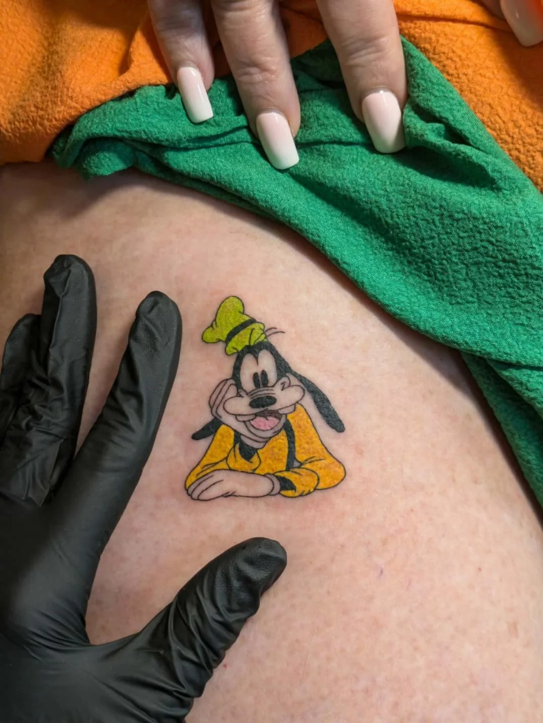Goofy illustrative tattoo on the thigh by Ayla Stone, Salt Lake City, Utah