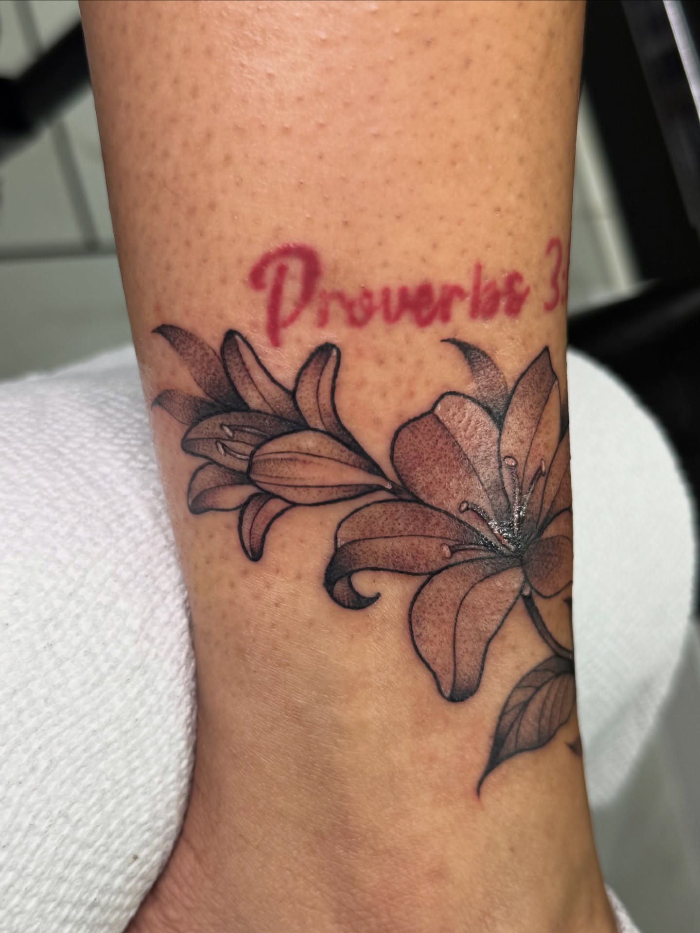 Lilies dotwork tattoo on the forearm by Tattoo Artist