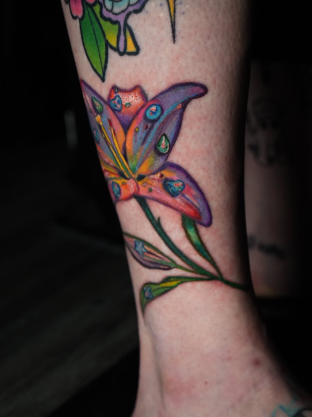 Lily new school tattoo on the forearm by Rayvin Patton