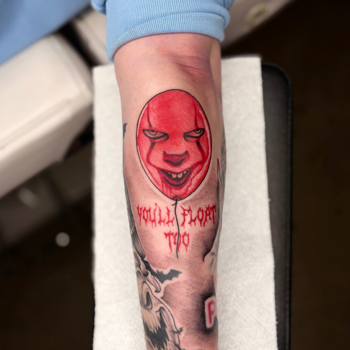 IT balloon realism tattoo on the forearm by Lauren Dempsey, Dearborn, Michigan
