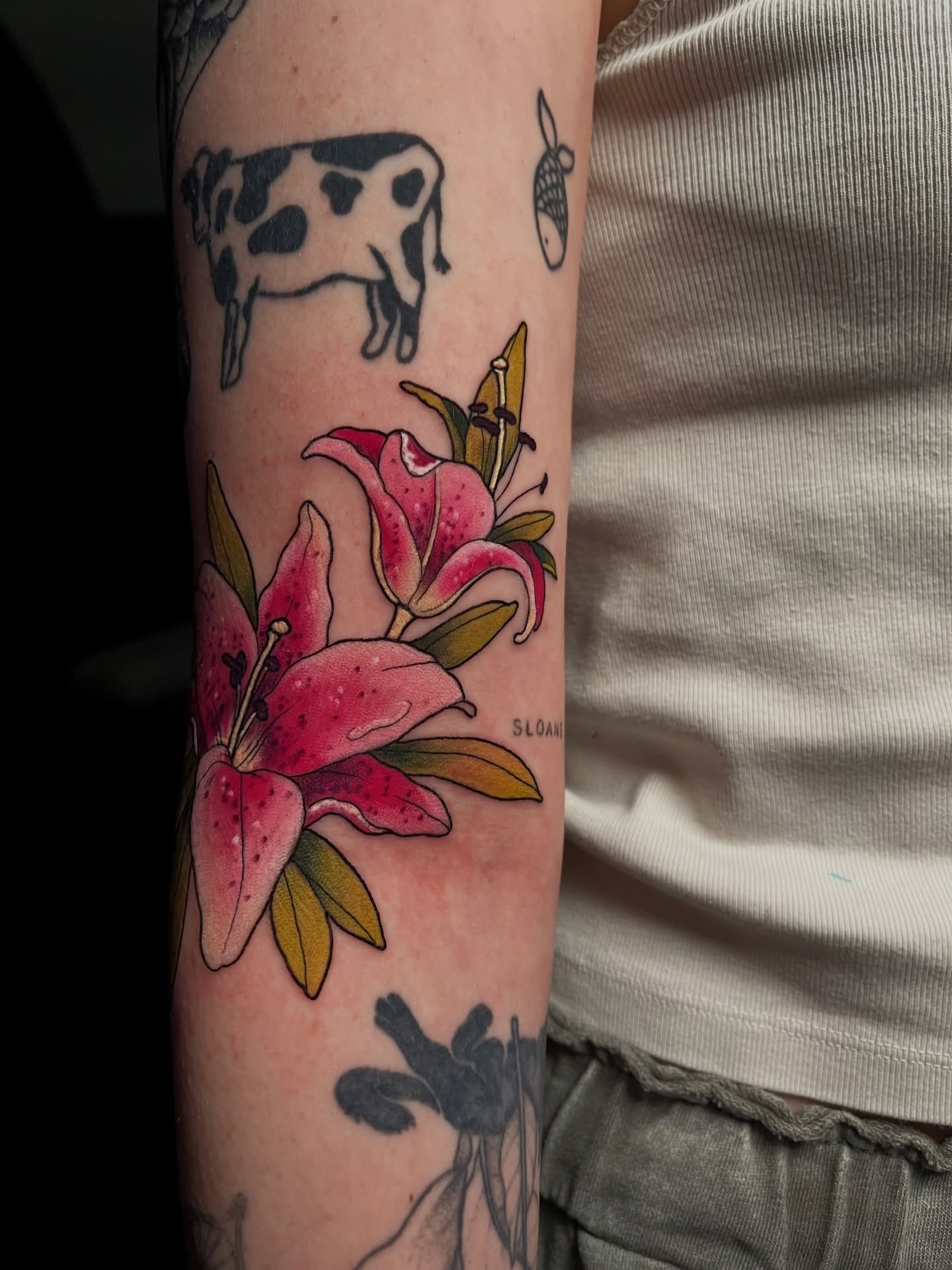 Lilies American traditional tattoo on the forearm by Summer Machelle, Orange, California
