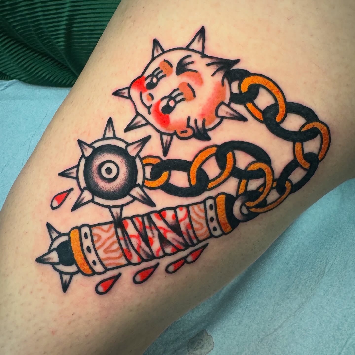 Cat and chain American traditional tattoo on the forearm by Rafael Torres, San Francisco, California