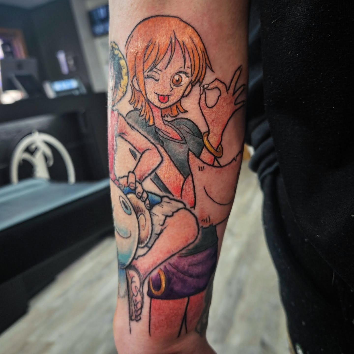 Anime character anime tattoo on the forearm by Damian Eames