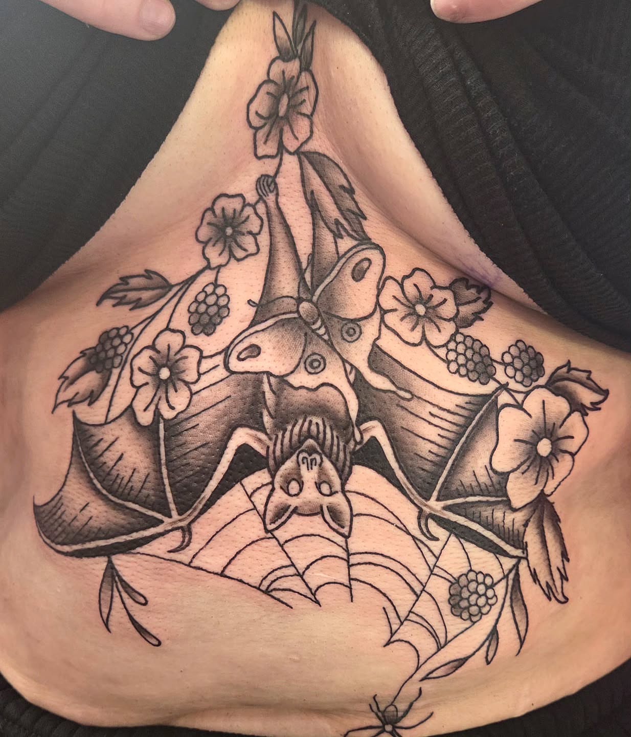 Bat and flowers black and grey tattoo on the ribs by Kat Coniglio Art