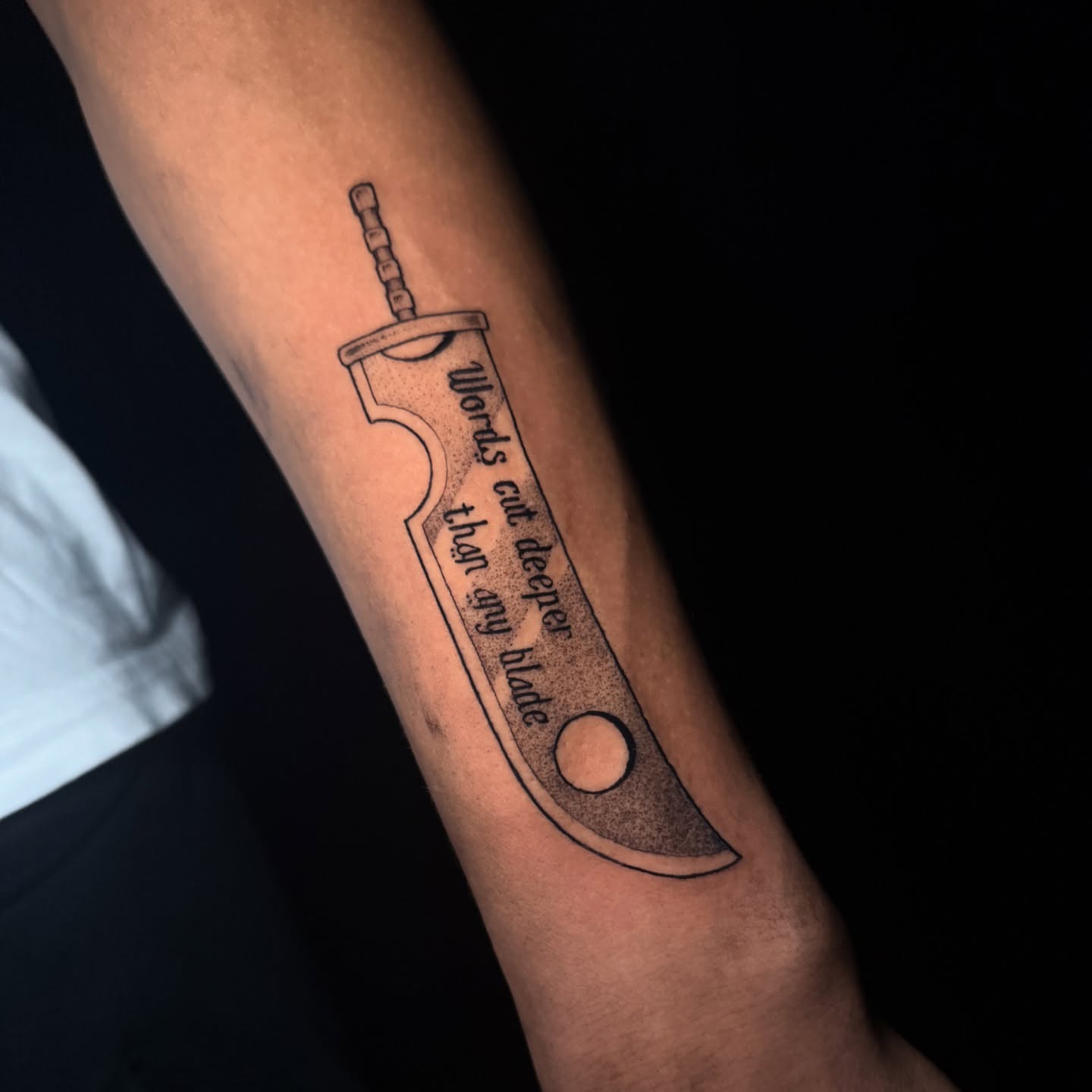 Knife blade dotwork tattoo on the forearm by Lauren B