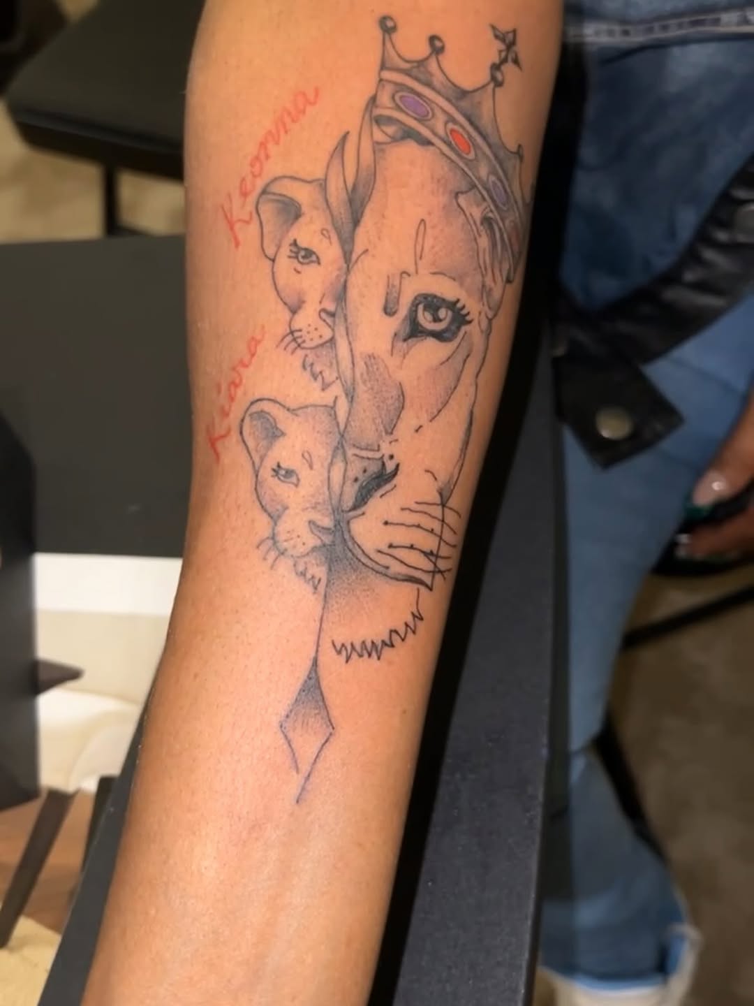 Lioness with cubs and names realism tattoo on the forearm by Deangelo Inkcrazy Dukes