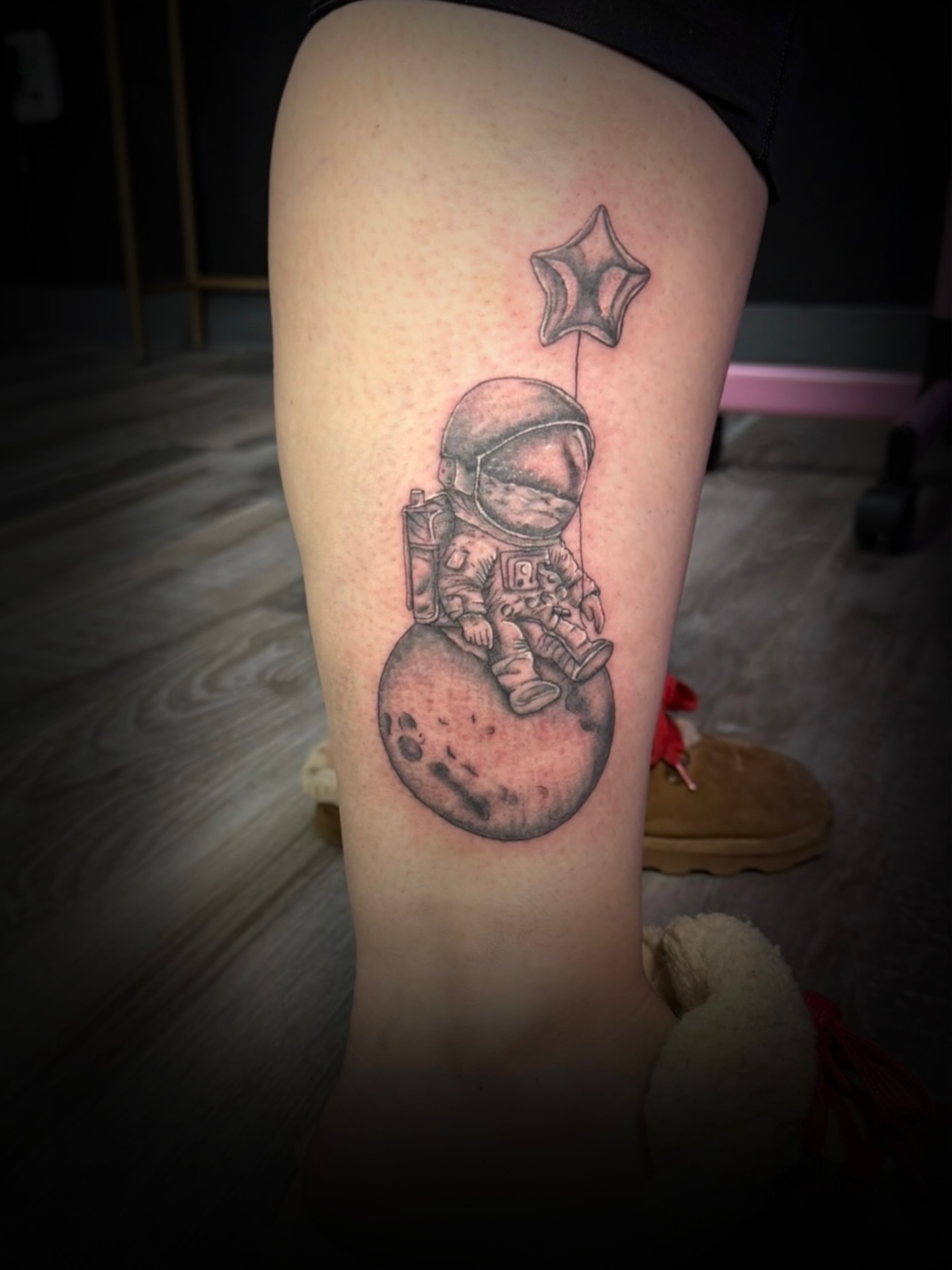 Astronaut on moon realism tattoo on the thigh by Kiersten Tickle