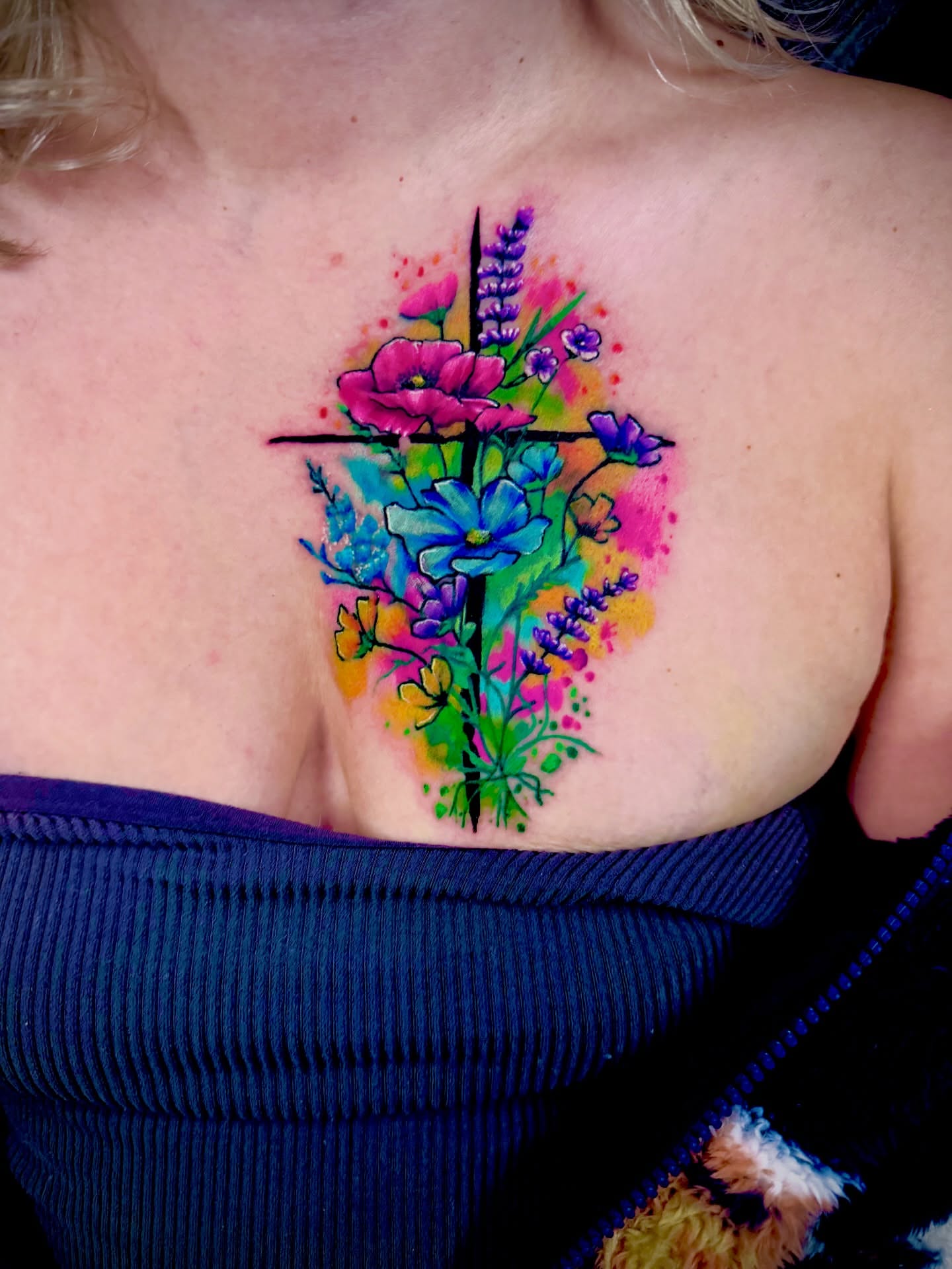 Wildflowers watercolor tattoo on the chest by John Ayson, Murrieta, California