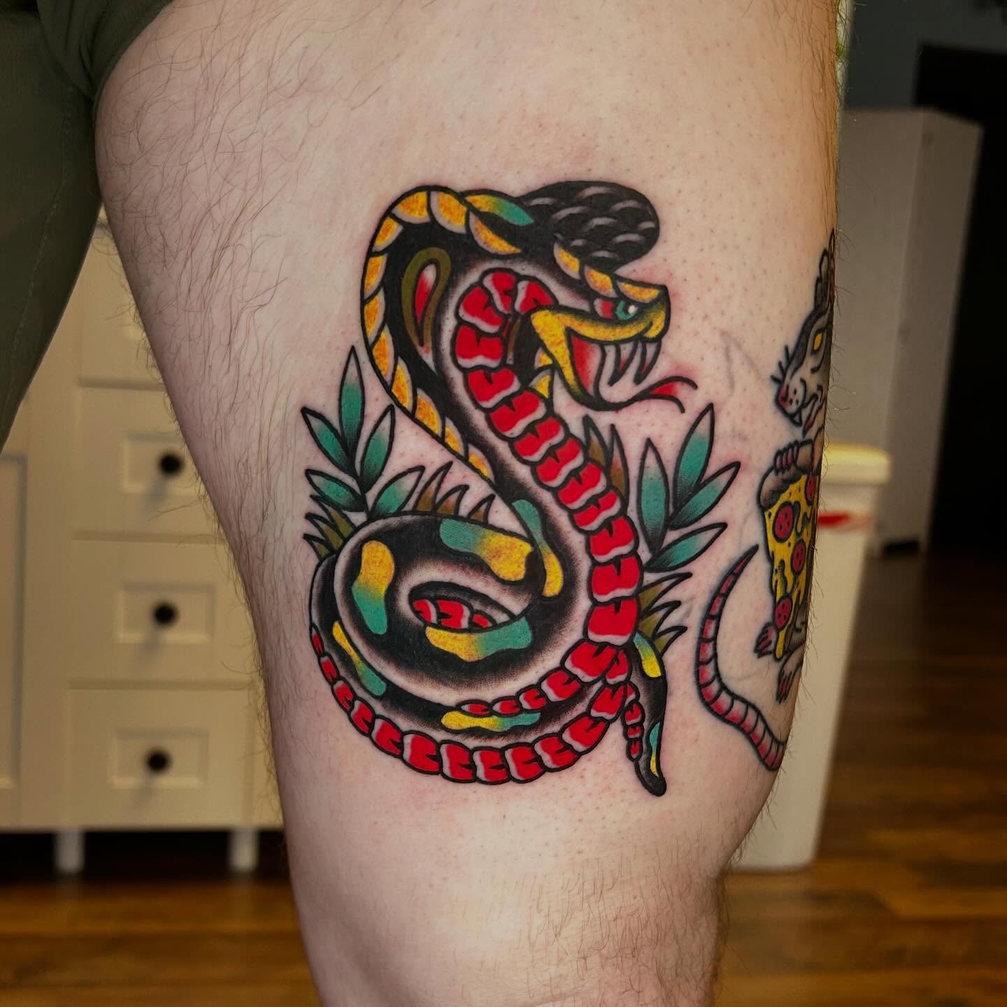 Snake American traditional tattoo on the thigh by Alexis Skye