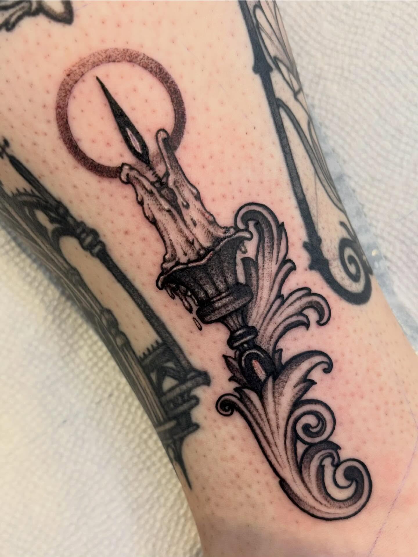 Lamp black and grey tattoo on the forearm by Tara, Exeter, Pennsylvania