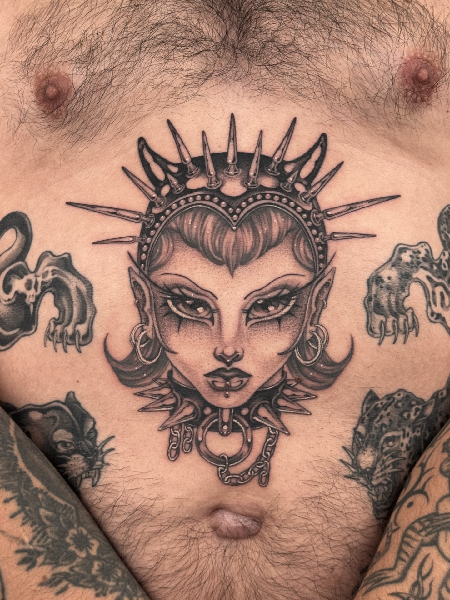 Woman with crown dark realism tattoo on the chest by ella