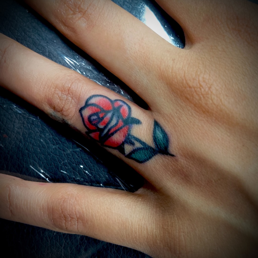 Rose American traditional tattoo on the hand by Vincent Figuccio