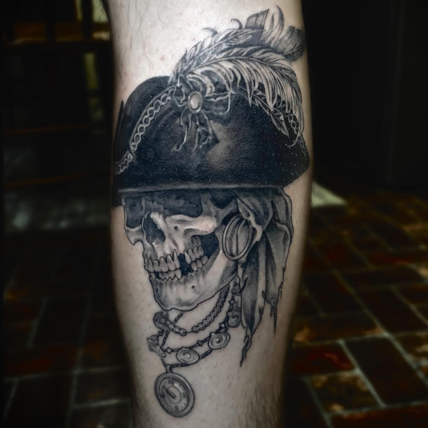 Pirate skull realism tattoo on the forearm by Tad Fulkerson, San Francisco, California