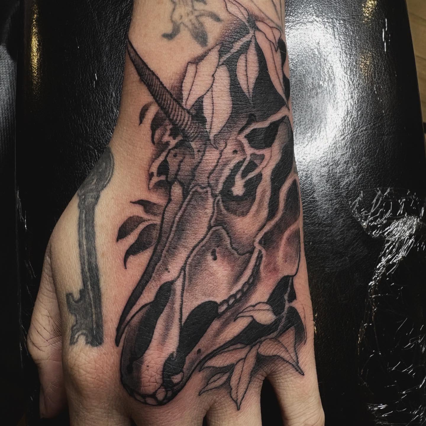 Skull realism tattoo on the hand by Tad Fulkerson, San Francisco, California
