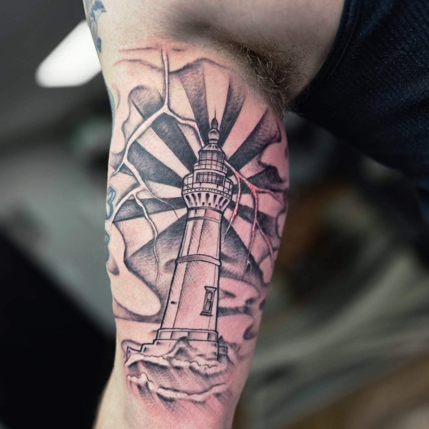 Lighthouse realism tattoo on the forearm by Jon Griffin, Maryville, Tennessee