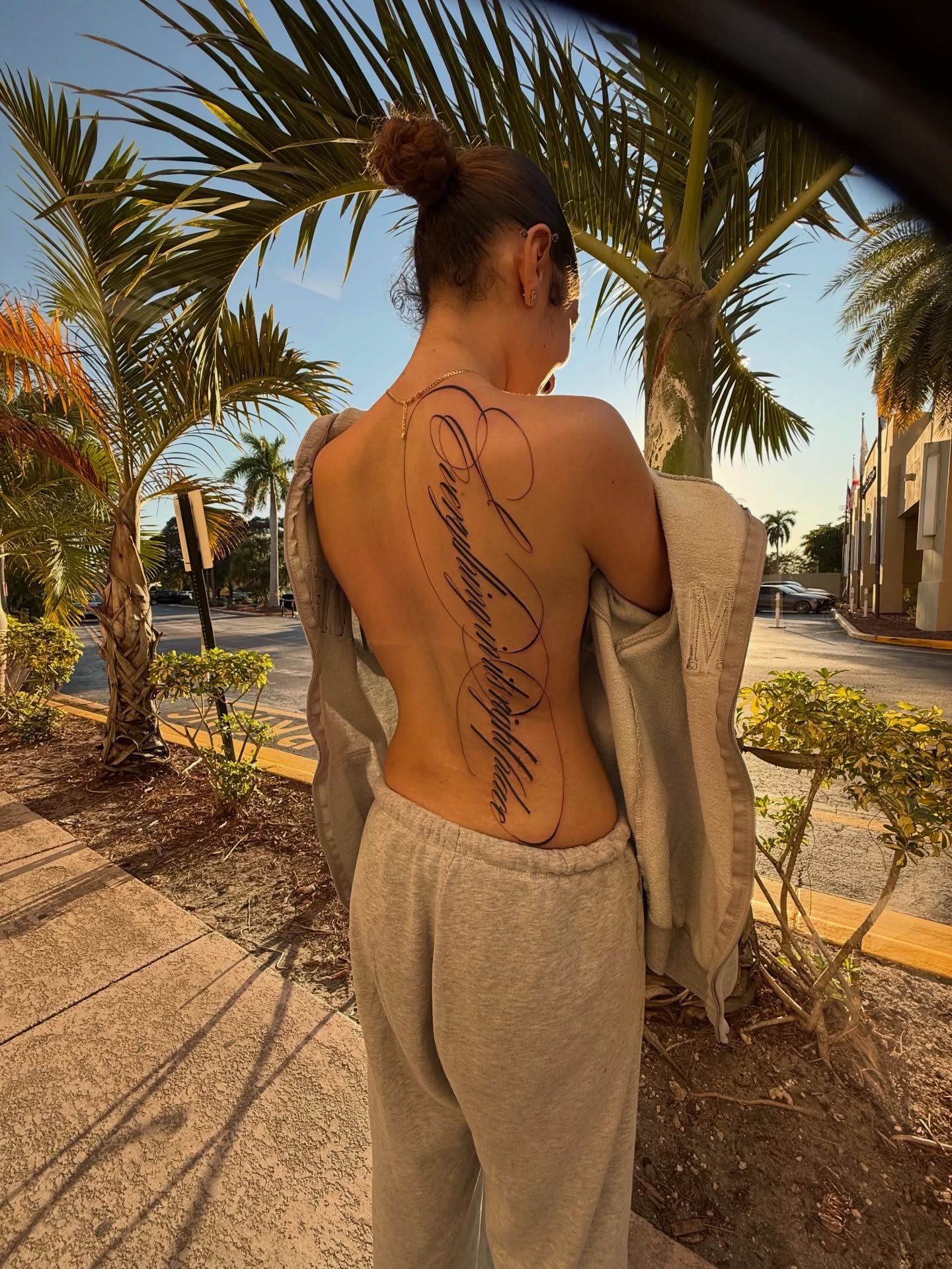 Script lettering lettering script tattoo on the back by Elijah Cosme, Miami, Florida