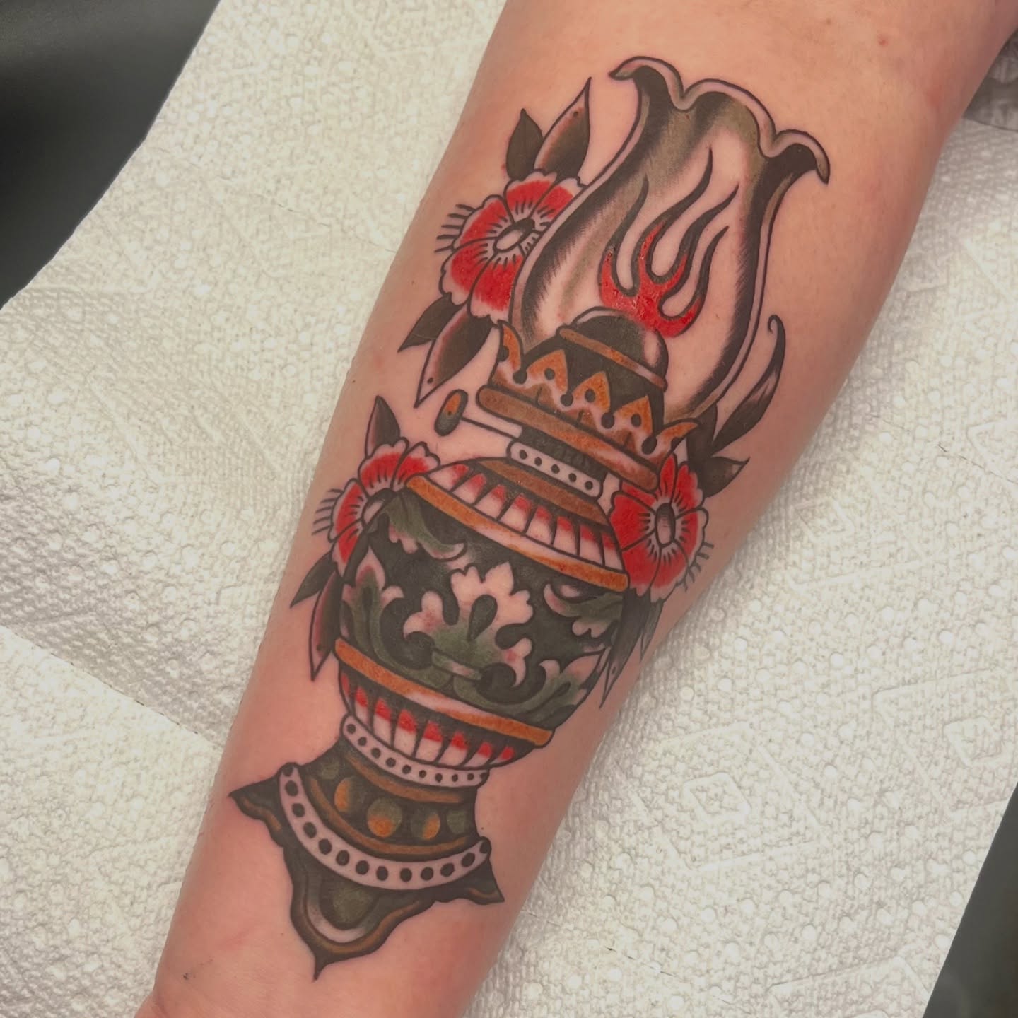 Urn with flames and flowers American traditional tattoo on the forearm by @brandonhuckabey, Denver, Colorado