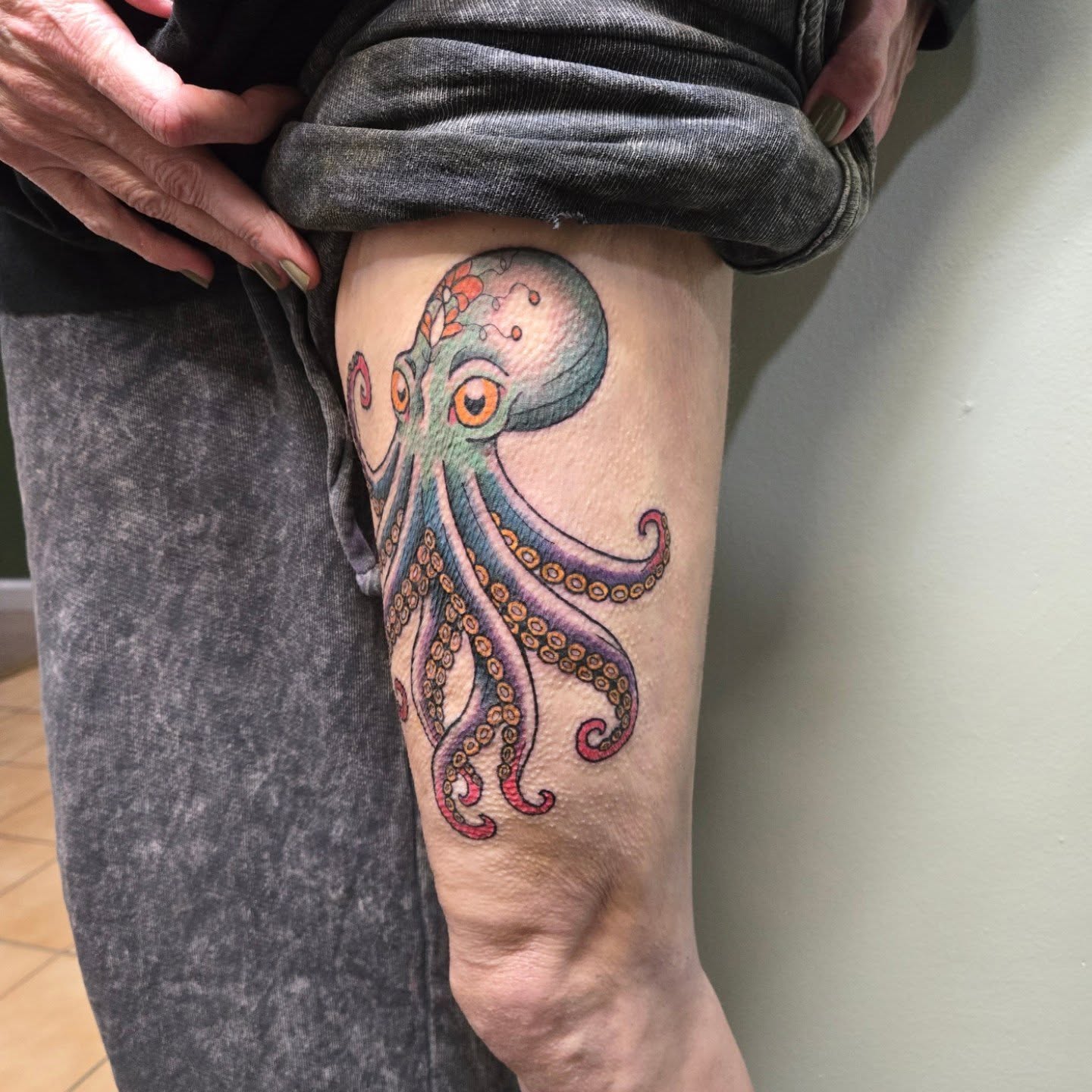 Octopus realism tattoo on the thigh by Matt Page