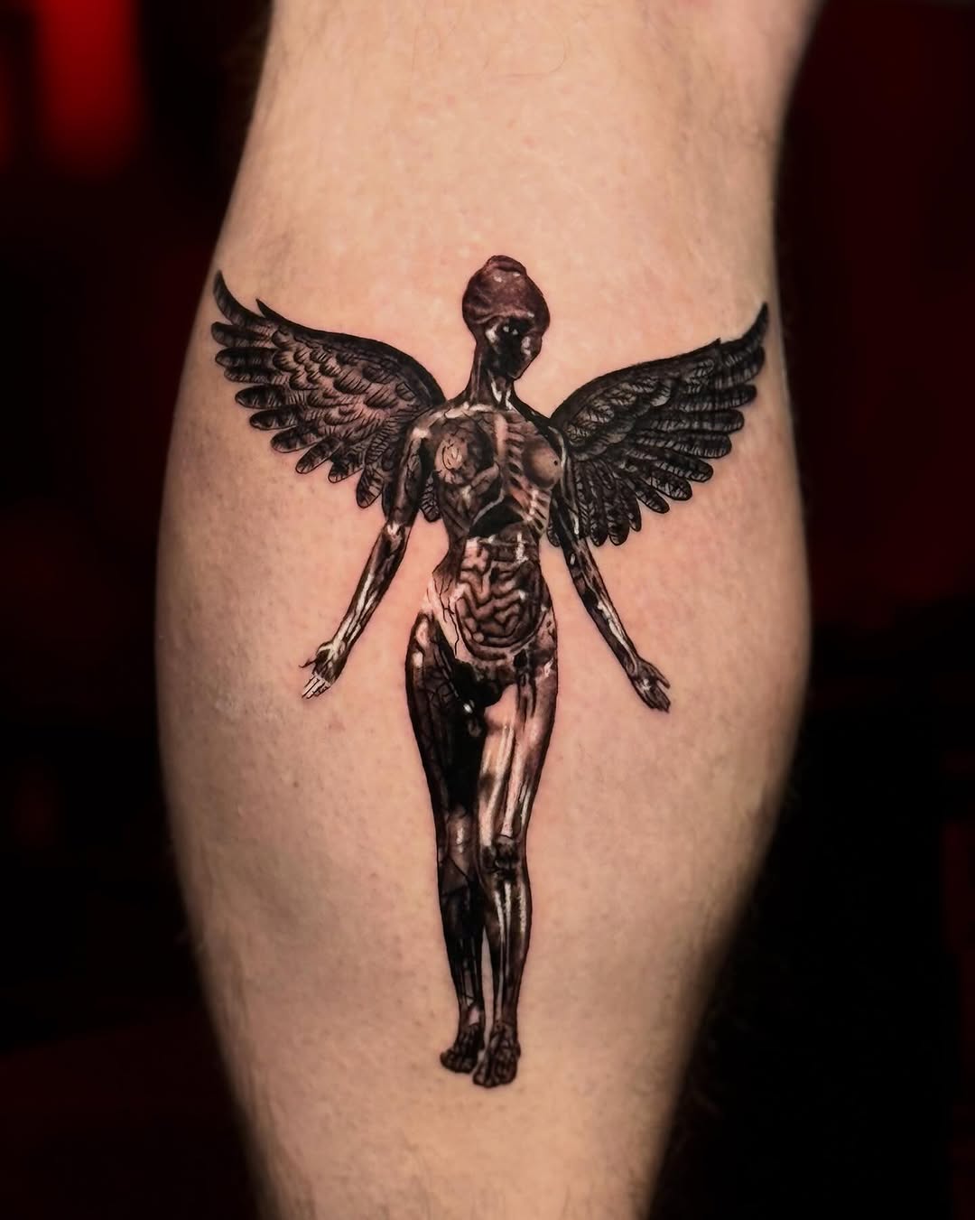 Winged anatomical figure realism tattoo on the thigh by Scott!!!