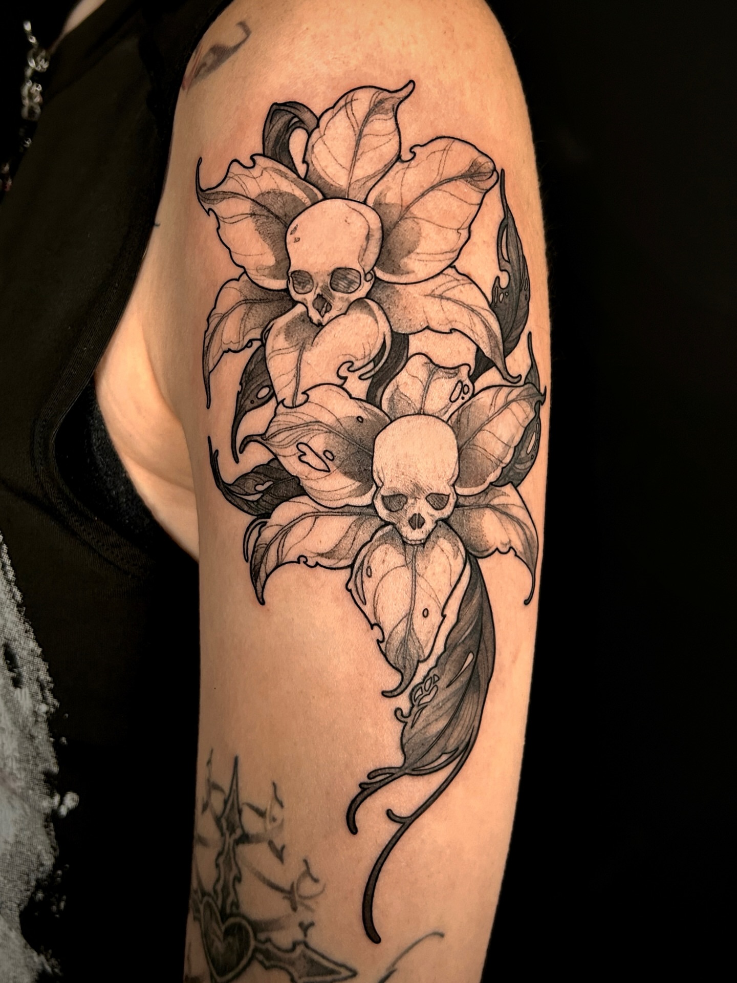 Skulls and flowers realism tattoo on the forearm by ♡ hayley ♡