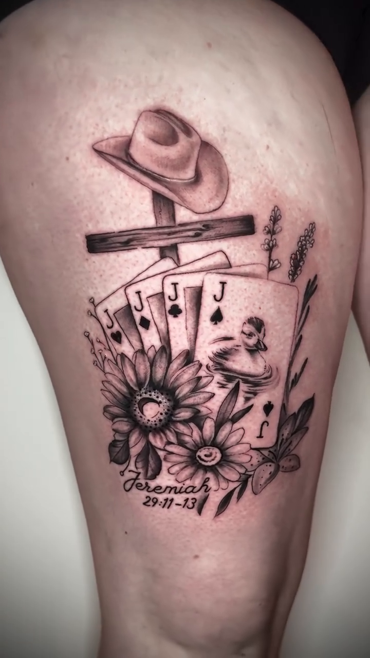 Cowboy hat, playing cards, and sunflowers realism tattoo by Matthew Crawley