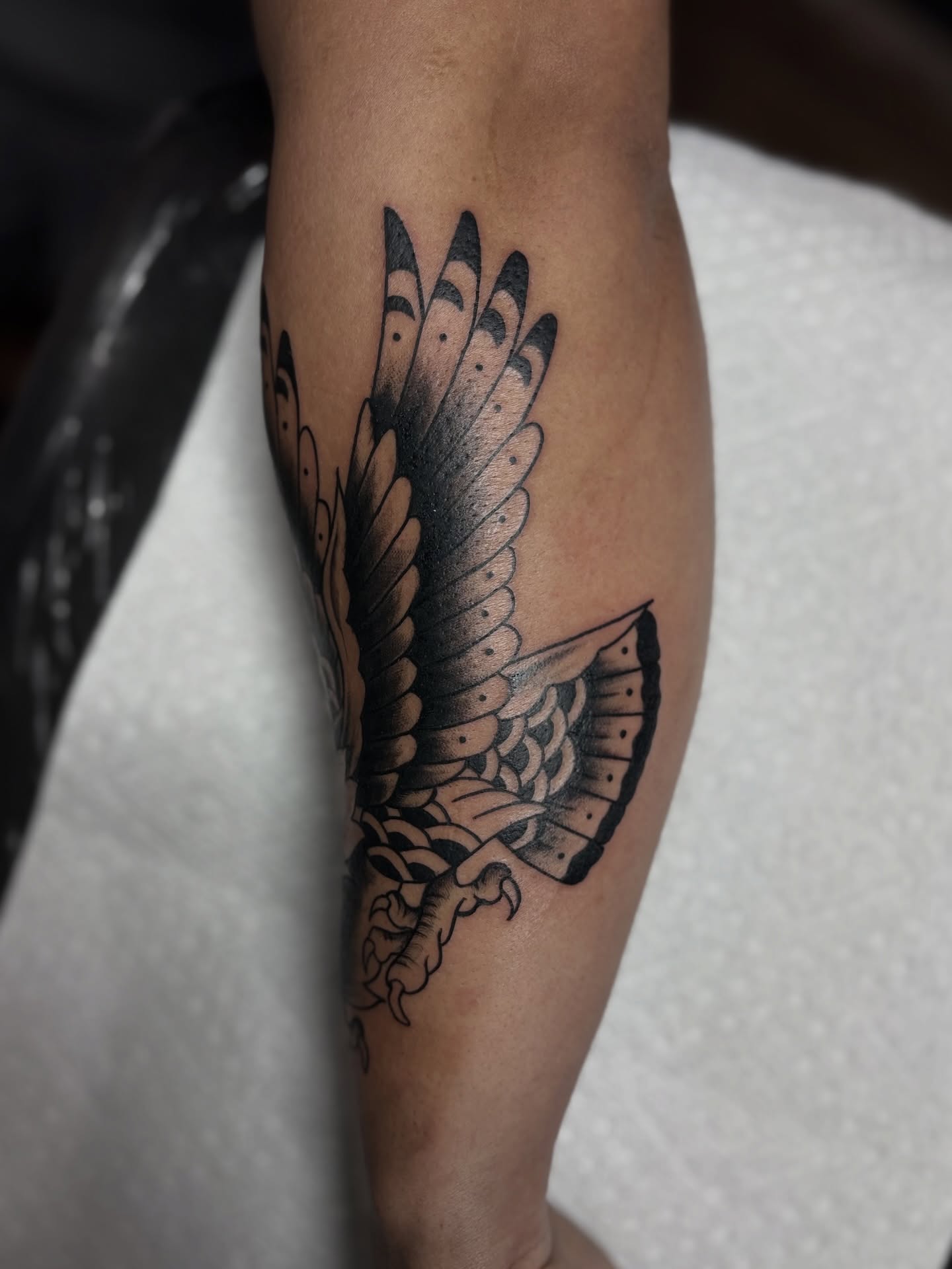 Bird black and grey tattoo on the forearm by Messias Tattoo Artist