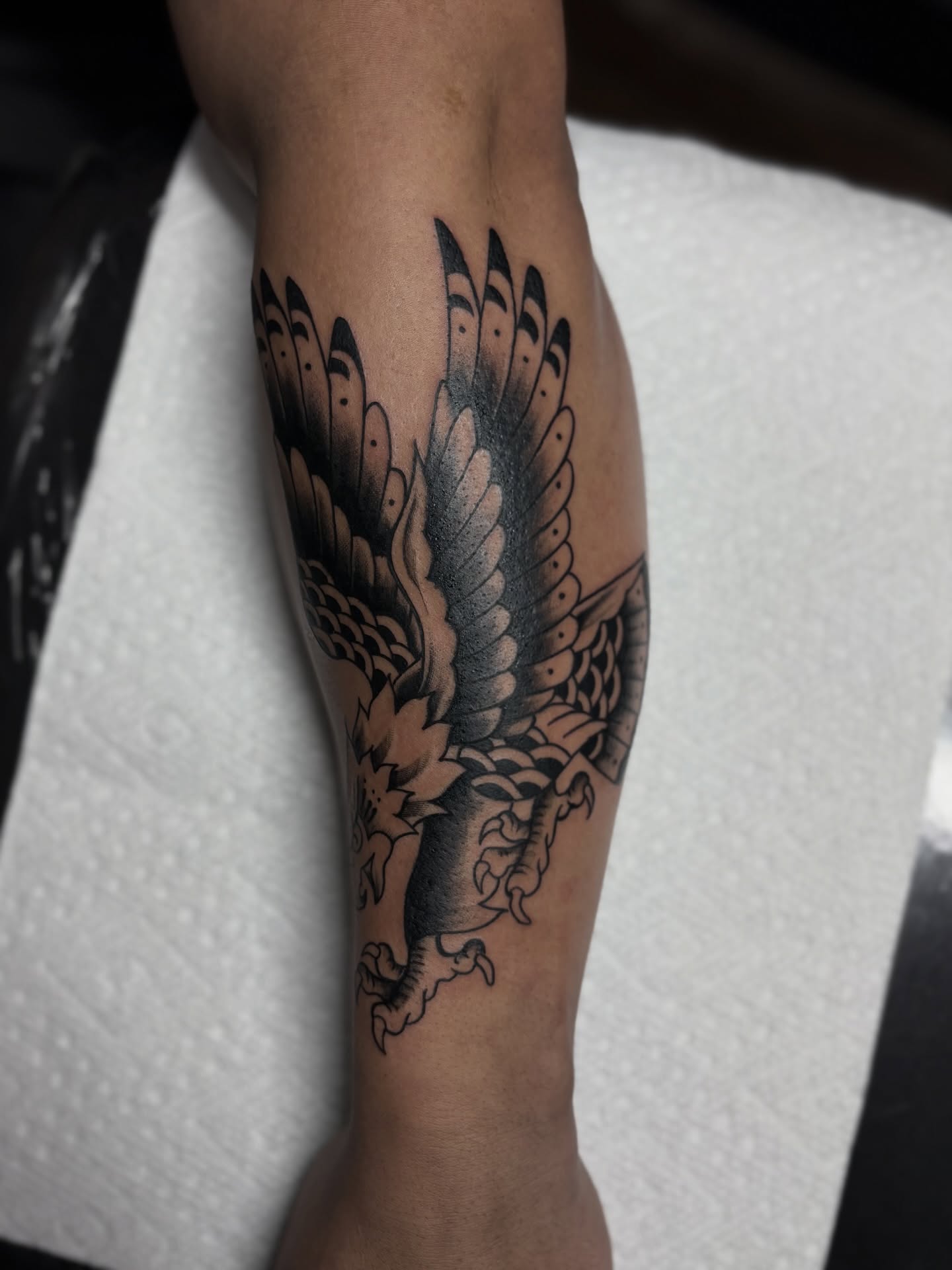 Eagle American traditional tattoo on the forearm by Messias Tattoo Artist