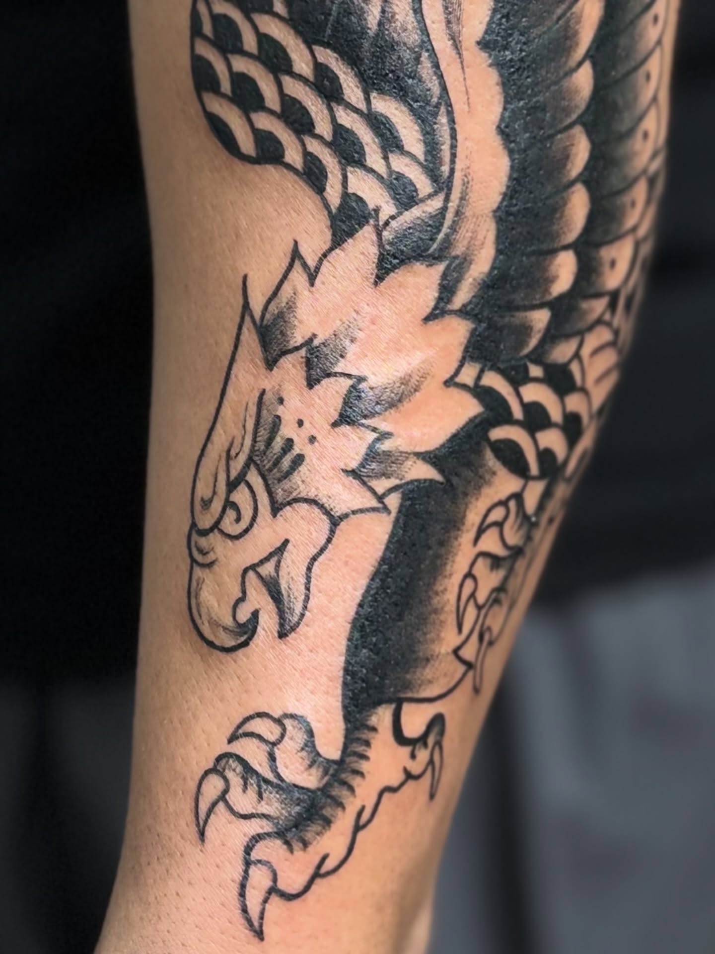 Dragon American traditional tattoo on the forearm by Messias Tattoo Artist