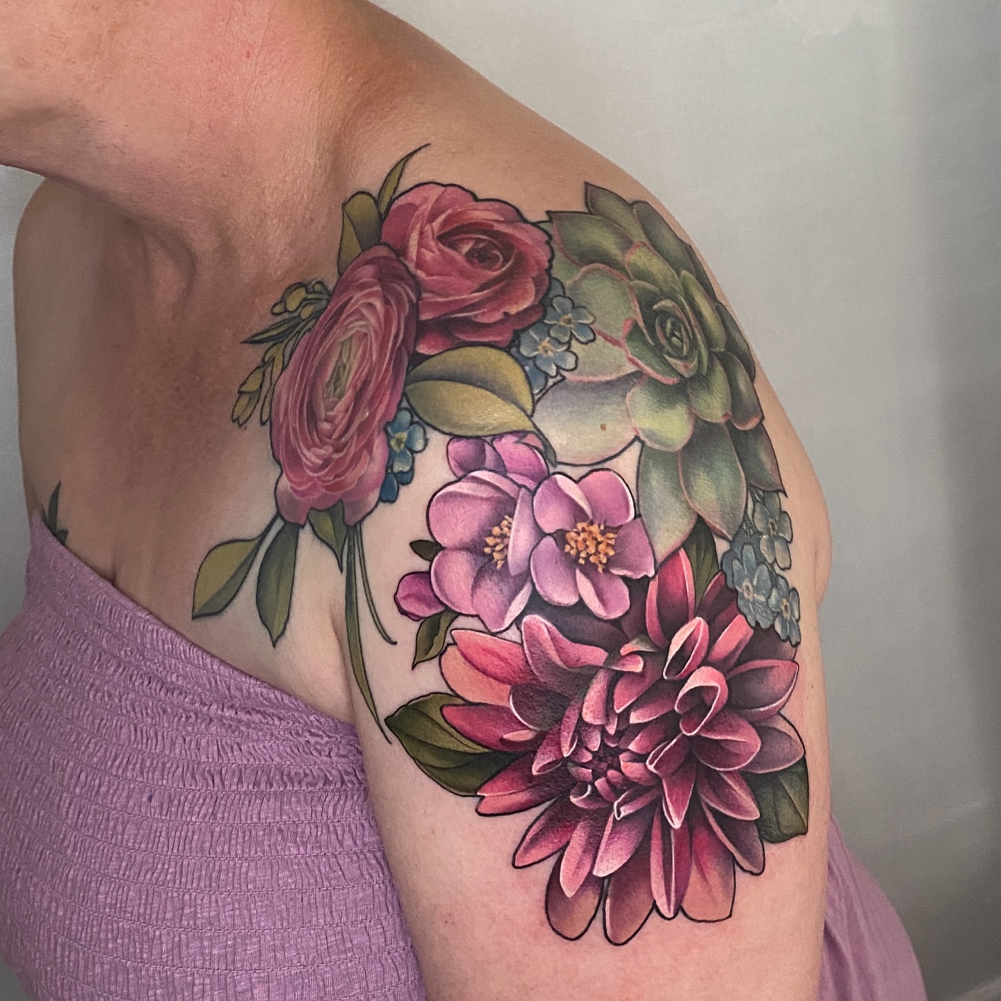 Floral bouquet new school tattoo on the shoulder by Anali De Laney