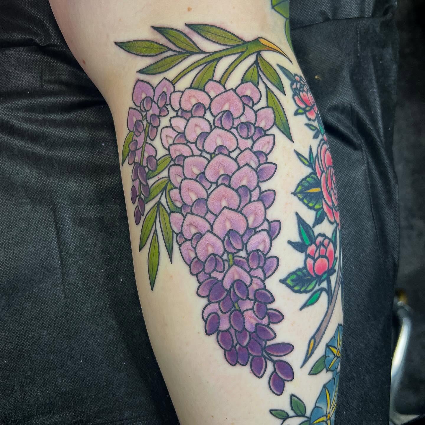 Wisteria new school tattoo on the forearm by Taylor Estrella