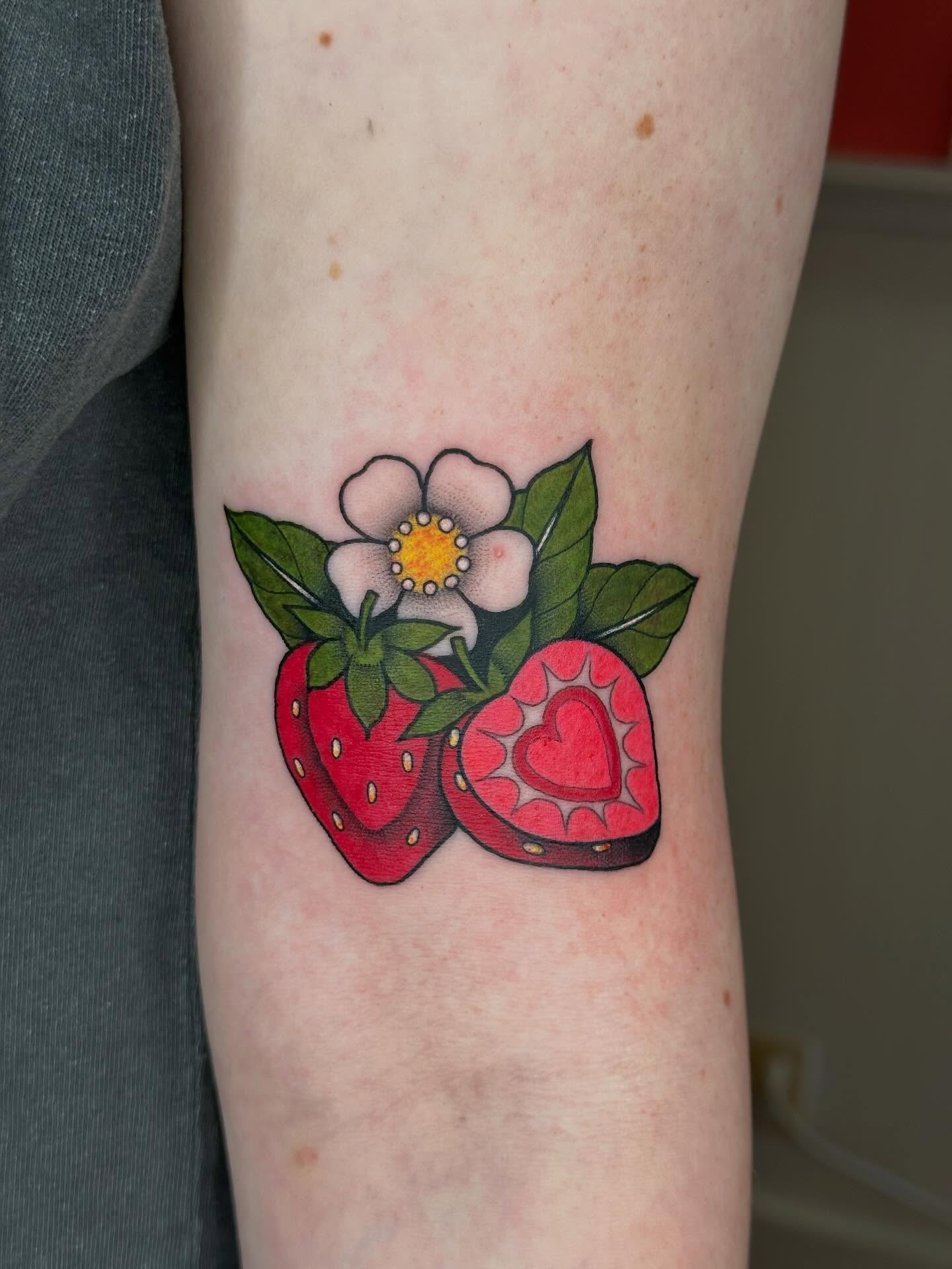 Strawberries and flower American traditional tattoo on the forearm by ✨ Mandy Foster - Bremerton Tattoo Artist✨, Bremerton, Washington