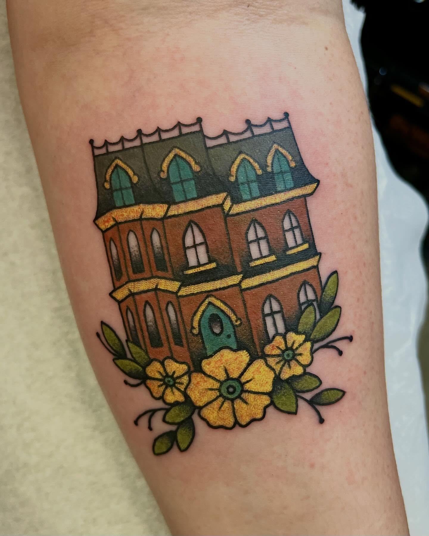 Gothic house with flowers American traditional tattoo on the forearm by jay