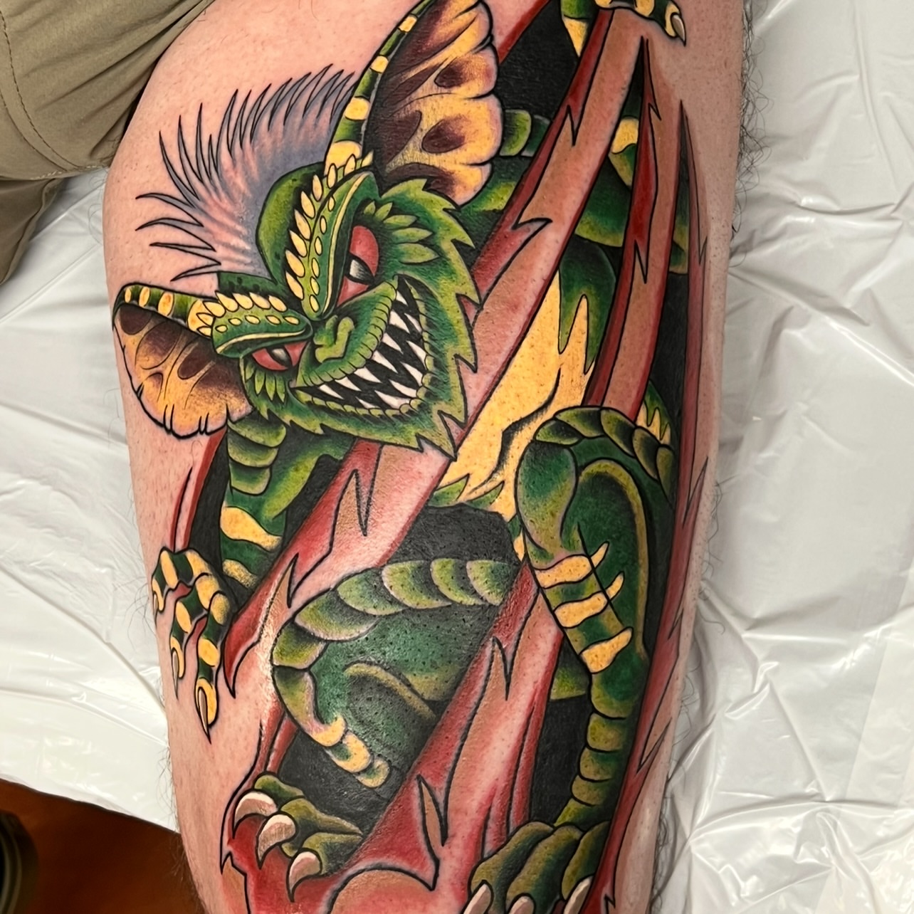 Dragon American traditional tattoo on the thigh by Bobby Tobin