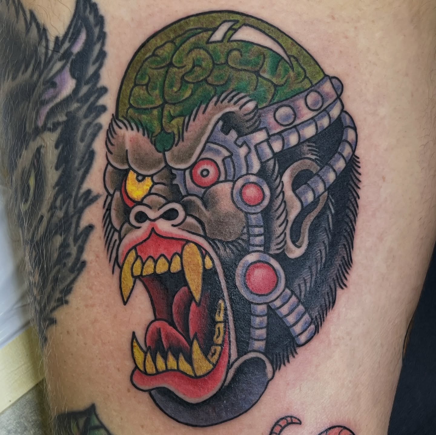 Cyborg gorilla American traditional tattoo on the thigh by Bobby Tobin