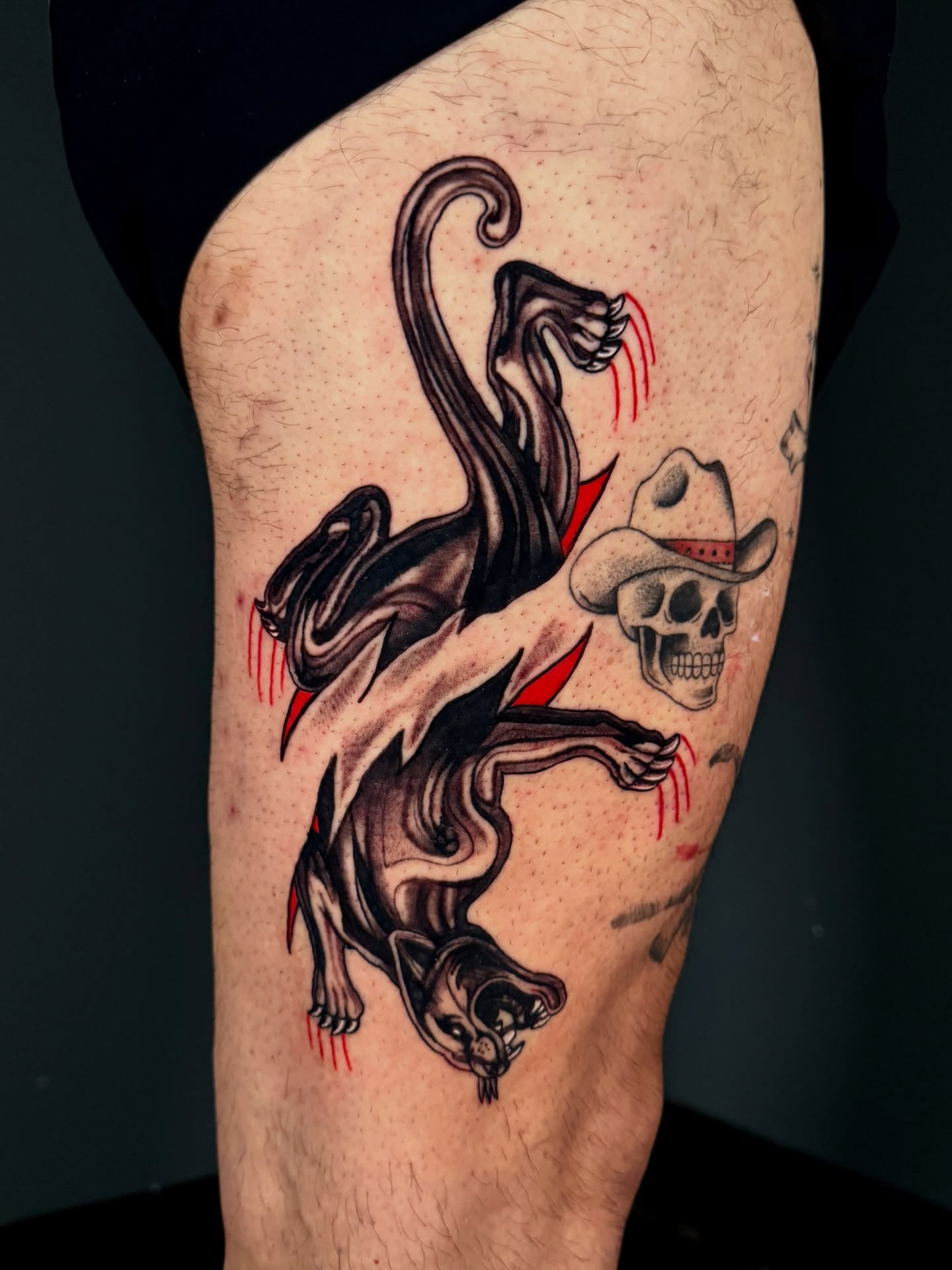 Demon and skull American traditional tattoo on the thigh by Dallas Tattoo Artist