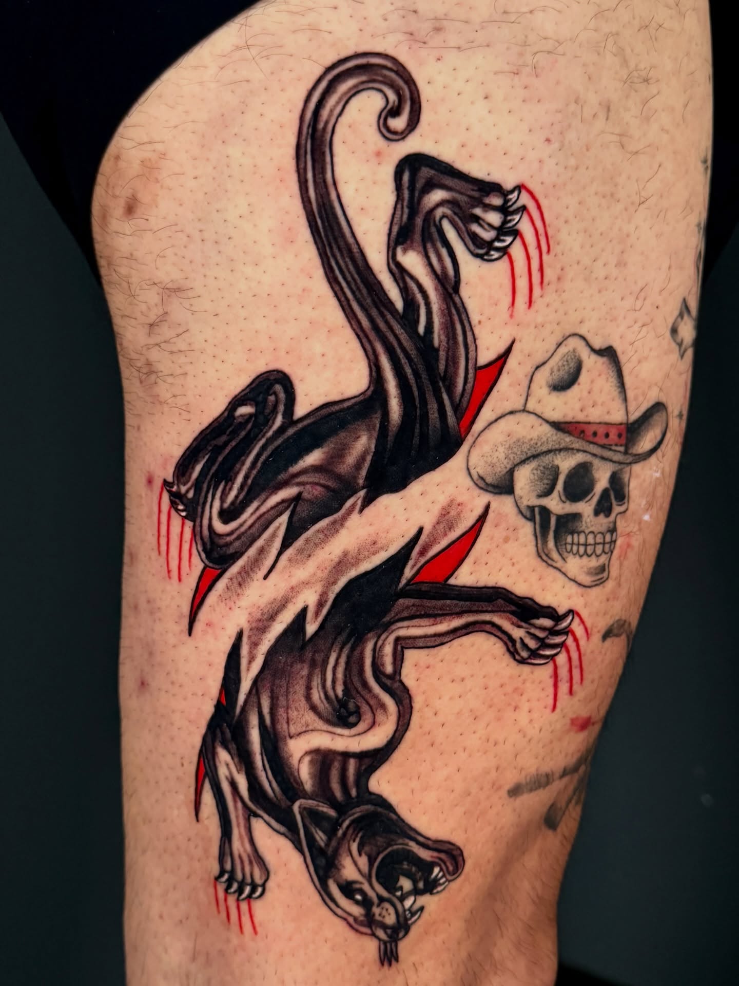 Panther and cowboy skull American traditional tattoo on the thigh by Dallas Tattoo Artist
