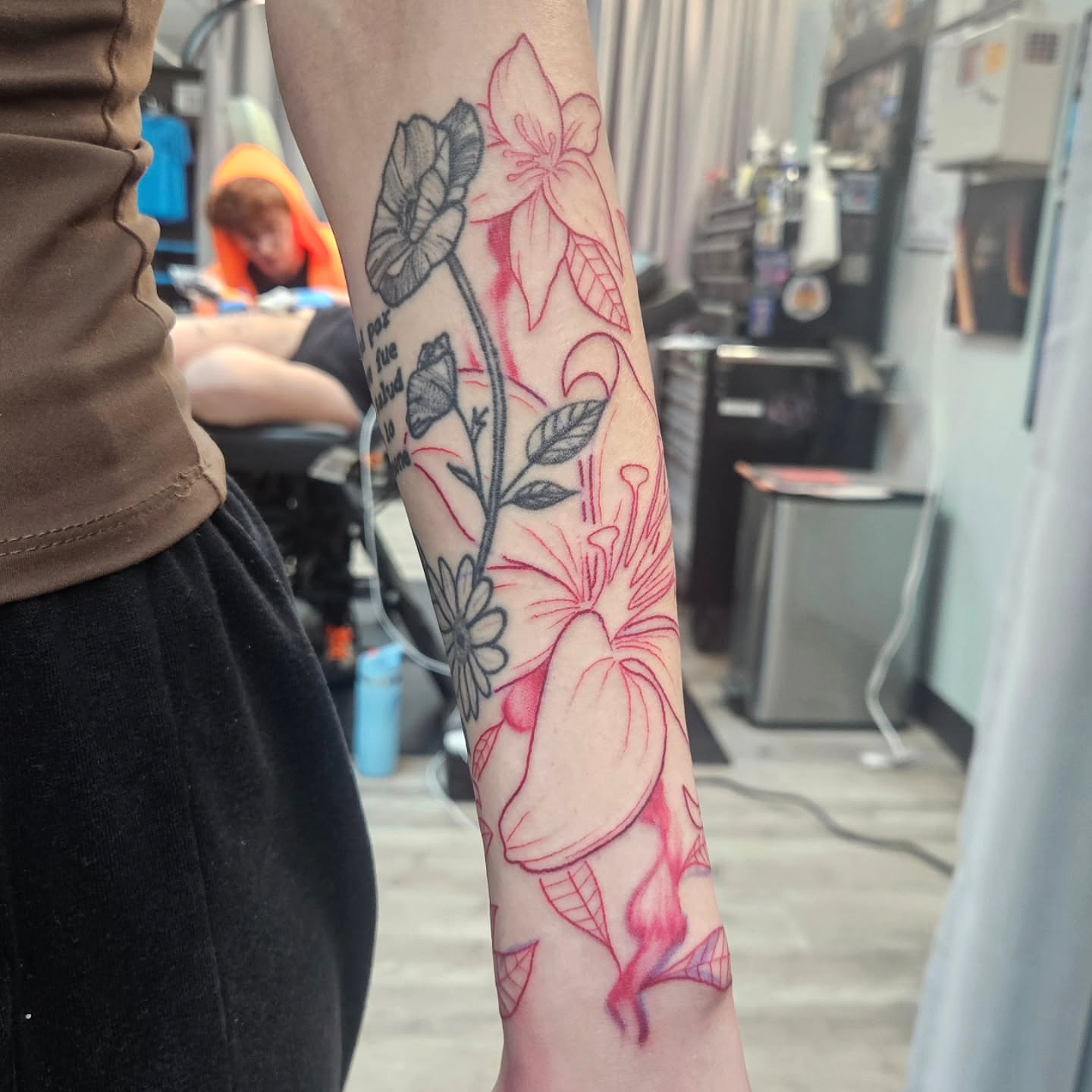 Floral arrangement new school tattoo on the forearm by Damian Eames