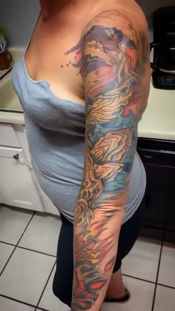 Dragon and clouds sleeve Japanese tattoo on the upper arm by Dharm, Denver, Colorado