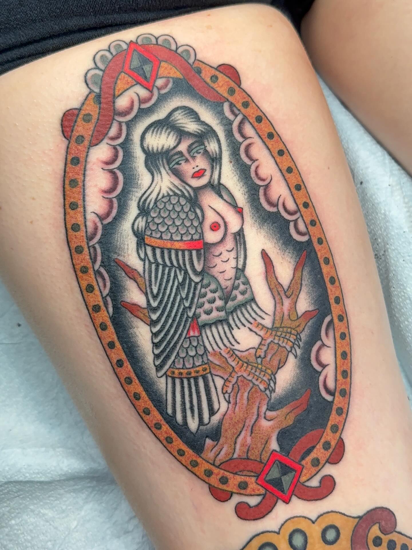 Mermaid American traditional tattoo on the thigh by Collin Rigsby, Minneapolis, Minnesota