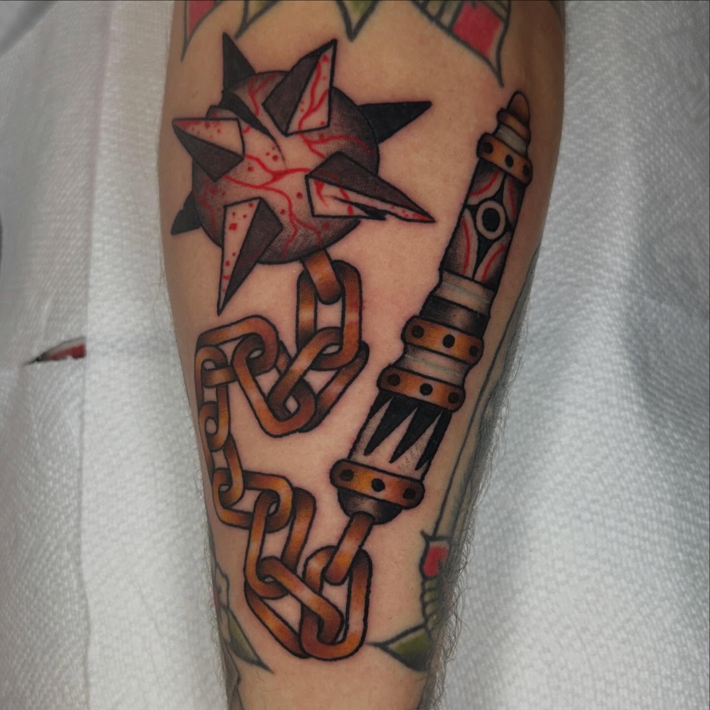 Chains and star American traditional tattoo on the forearm by Kyle Logan Frary